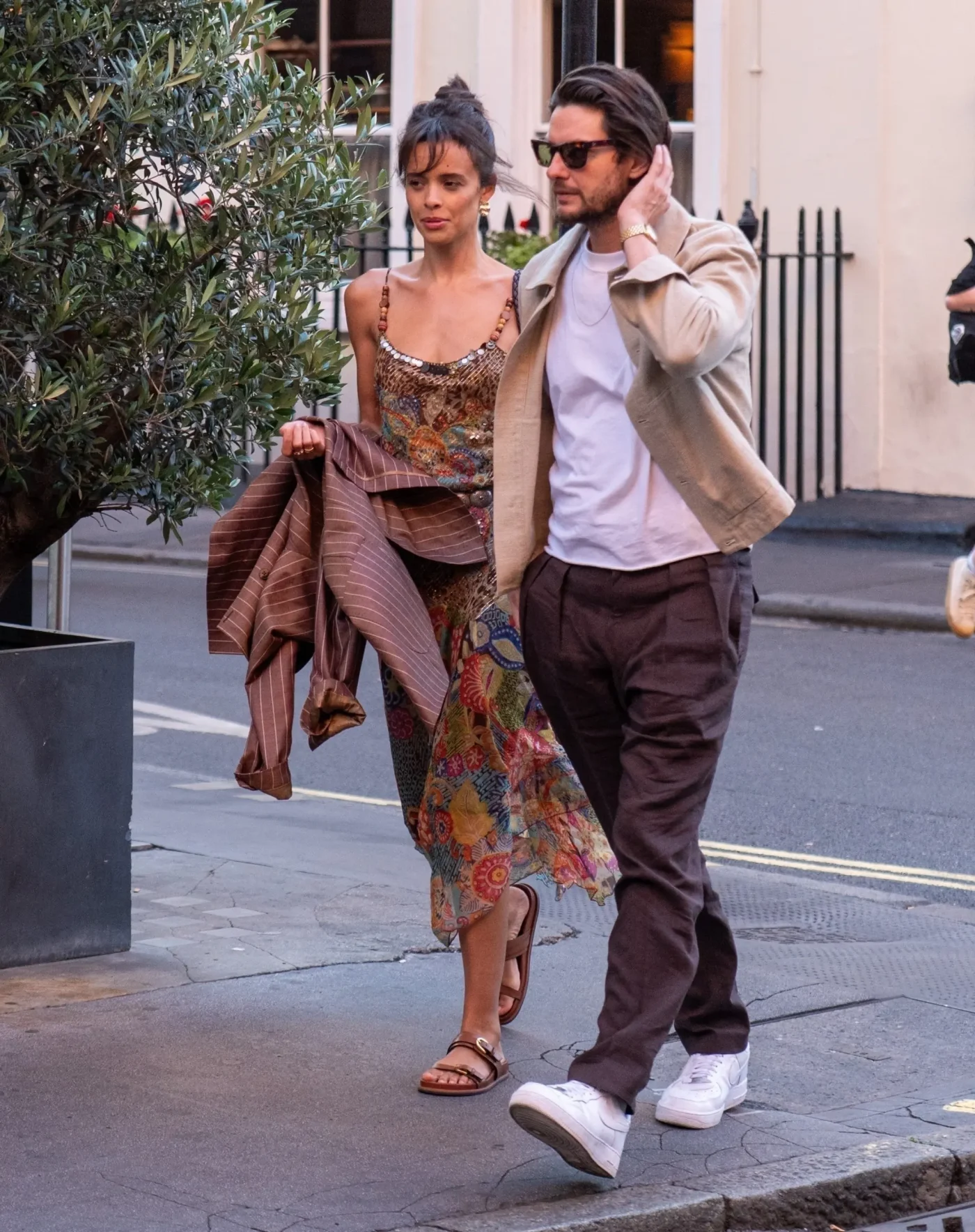 Ben Barnes and Aubrey Cleland walking arm in arm after a London dinner date.
