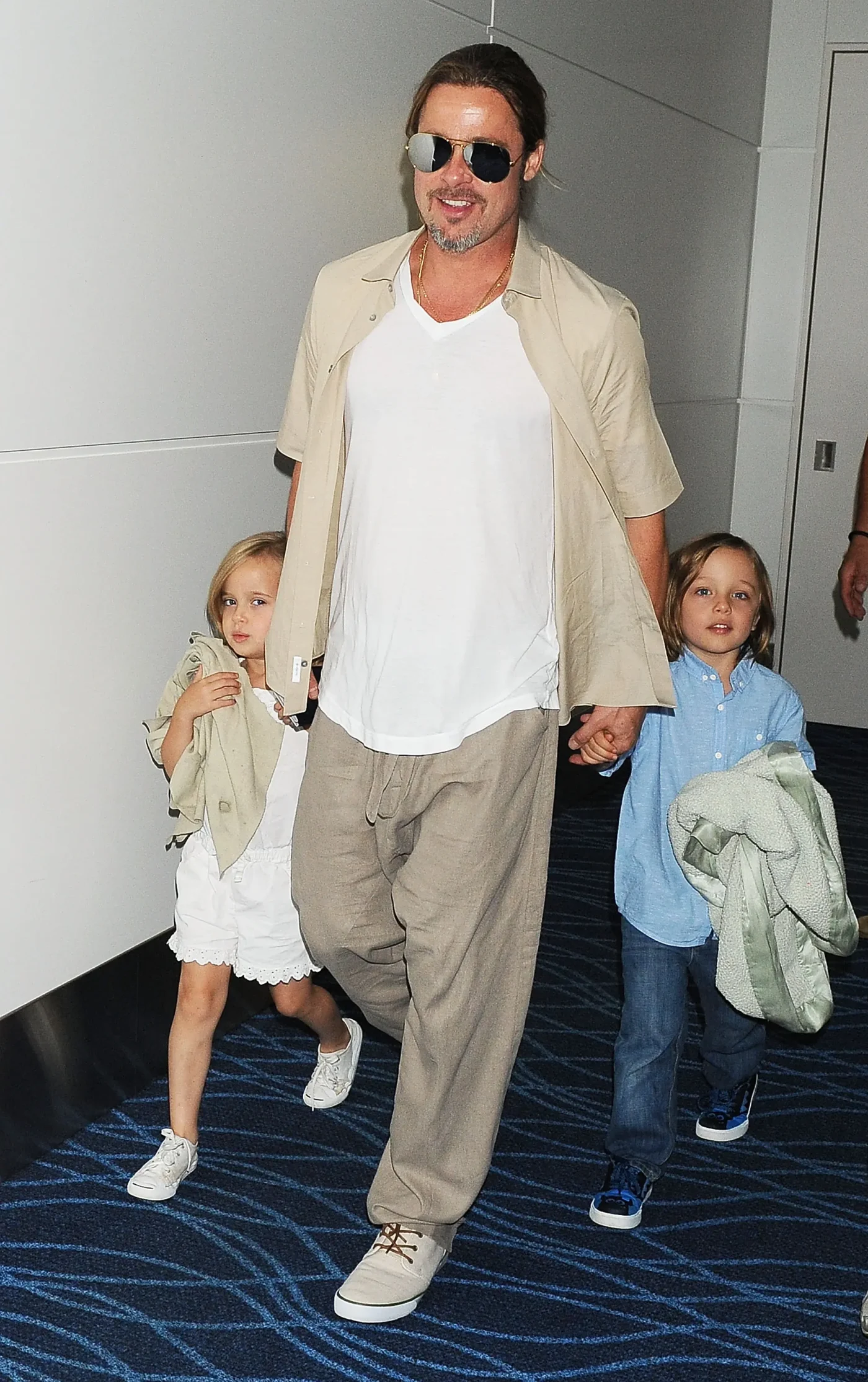 Brad Pitt holds hands with Knox and Vivienne Jolie-Pitt.