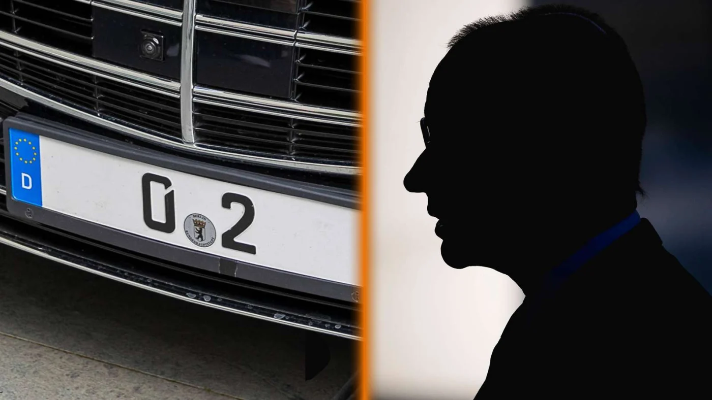 Kennzeichen vom Bundeskanzler und Silhouette von Friedrich Merz.